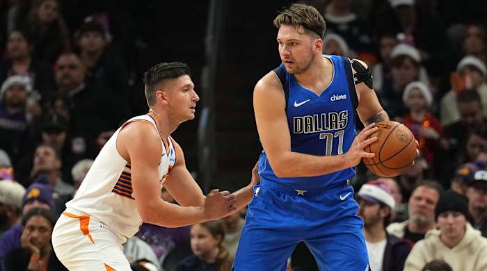 Mavericks’ Luka Doncic posts up vs. Suns’ Grayson Allen.